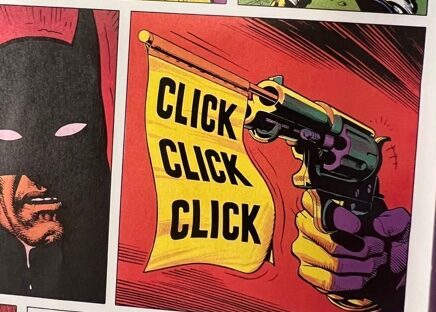 Batman looks forward while the Joker holds a gun that has a banner that flies out with the words “Click click click” on the banner.