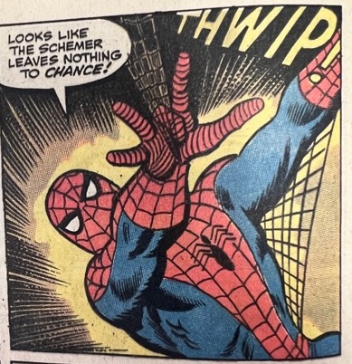 Spider-Man holds his hand in front of his body with the thumb, index finger, ring finger, and pinkie extended that shoot spider webs with a “Thwip” sound effect. Spider-Man says, “Looks like the scheme leaves nothing to chance!”